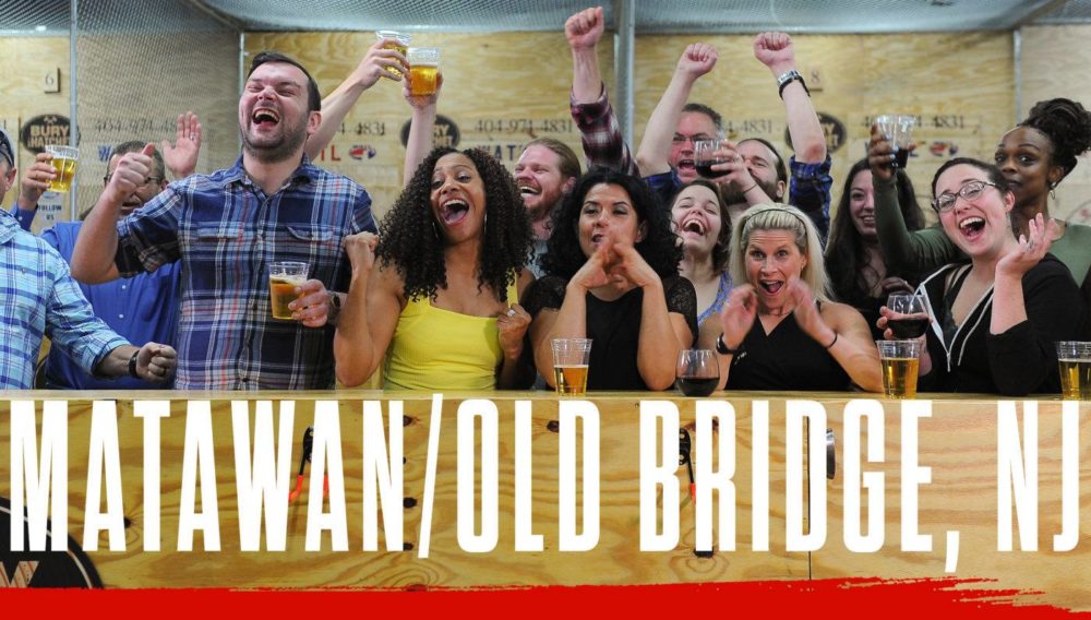 Bury The Hatchet Matawan Old Bridge NJ City Page Header Image. Axe throwers celebrating with hands in air